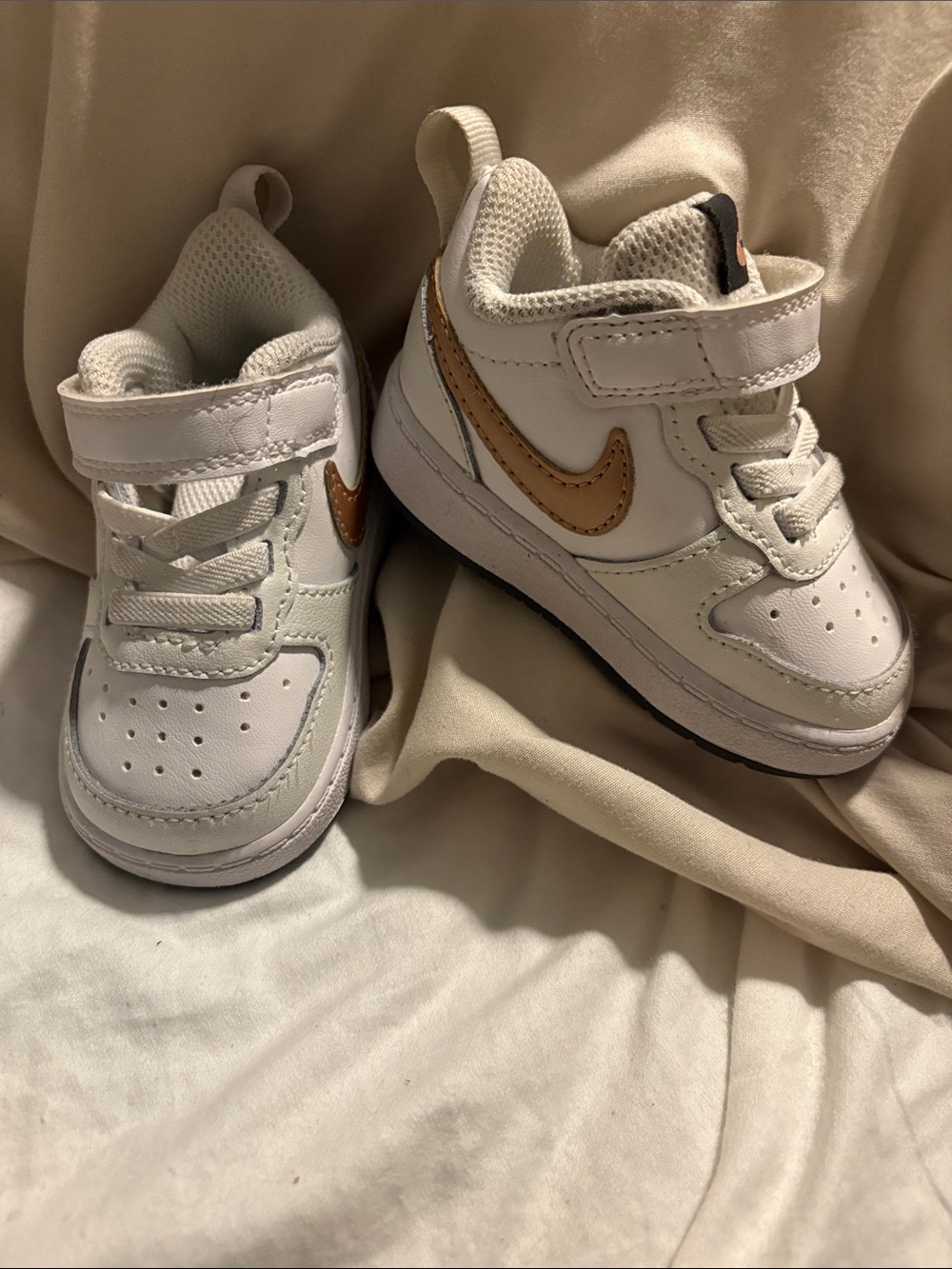 Nike Kids White Sneakers with Gold Swoosh